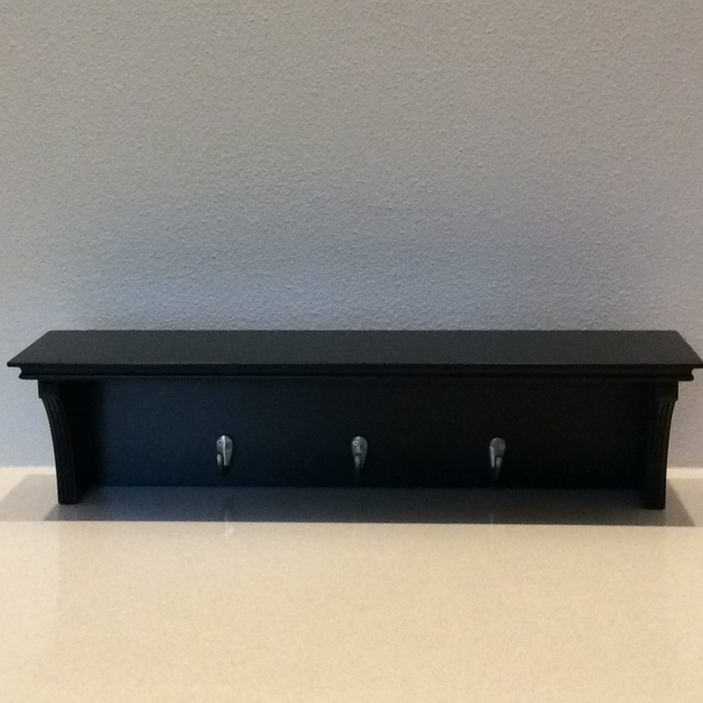 Black shelf with hooks
